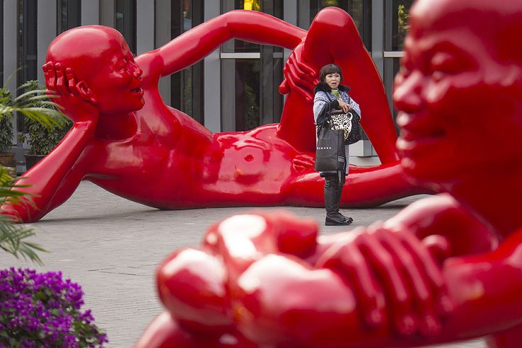 Sculptures by Chinese artist Chen Wenling are displayed in the central business district in Beijing, China.